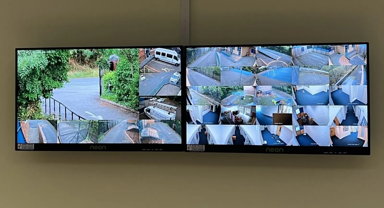 Control room with a wall of CCTV monitors