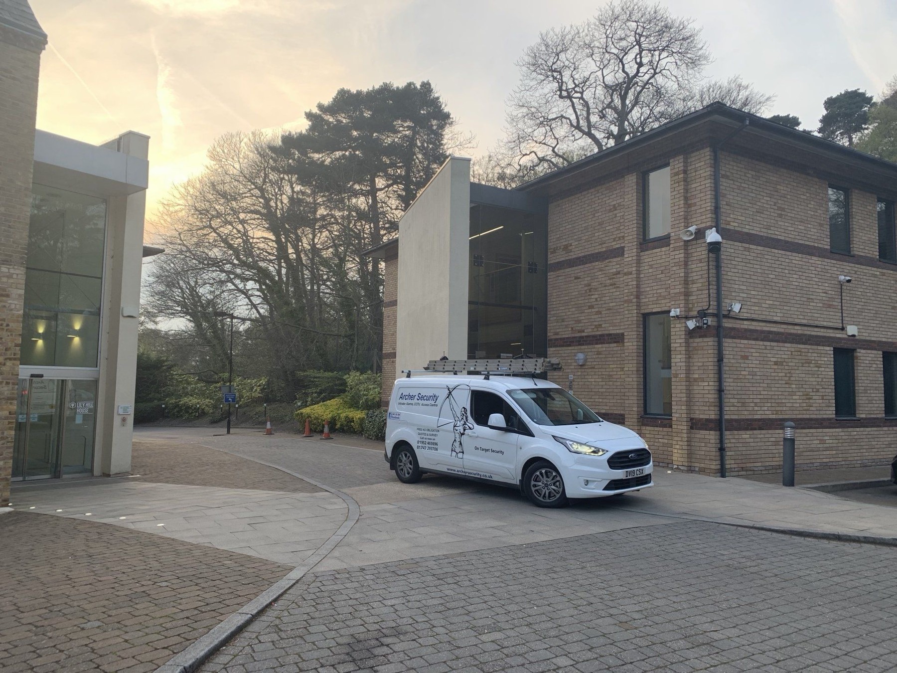 An Archer Security van parked at a commercial site.